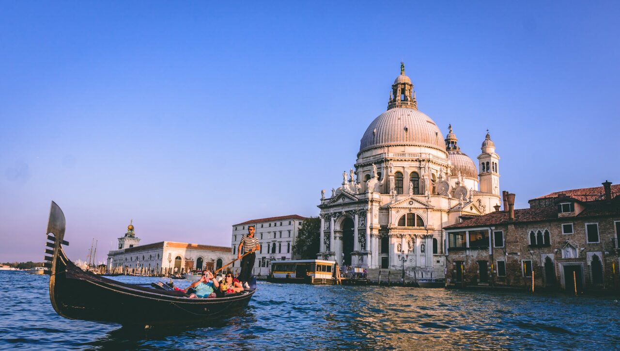 Timeless Romance in Venice Italy | Rome Florence & Venice - Stunning aerial view of Venice's Floating Beauty: Historic buildings lining picturesque canals